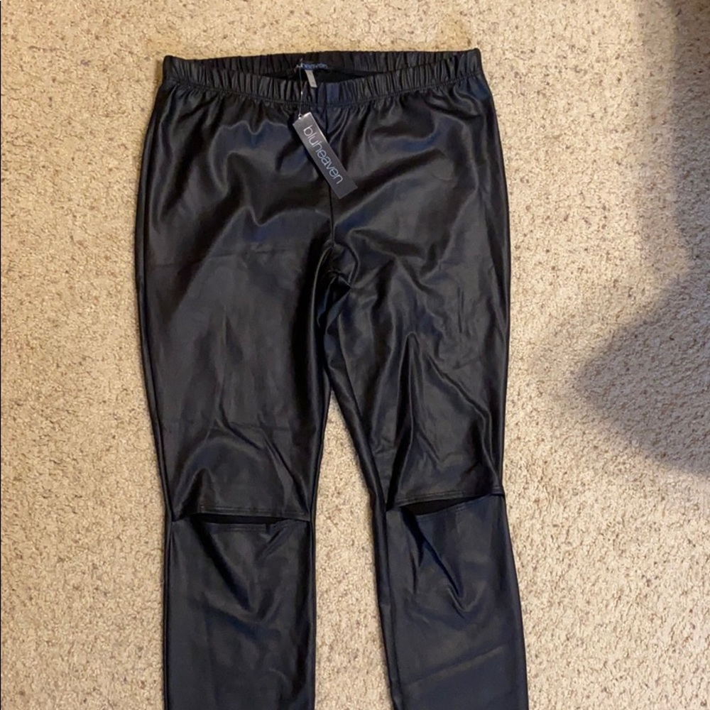 Blue Heaven pleather leggings with knee slits.